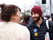 Actor Jake Gyllenhaal smiles with his sister Maggie at the Women&#39;s march against Trump