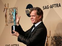 Actor William H. Macy holds the award he won for Outstanding Performance by a Male Actor in a Comedy Series for his role in &#34;Shameless&#34; at the 23rd Screen Actors Guild Awards in Los Angeles