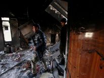 Members of the Iraqi forces inspect a hospital damaged by clashes during a battle between Iraqi forces and Islamic State militants in the Wahda district of eastern Mosul, Iraq, January 8, 2017