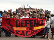 Native Americans protest about a sacred site disturbed by bulldozers building the pipeline