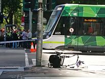 The wreckage of a pram is seen on the footpath in front of a tram on a main street after a car hit pedestrians in central Melbourne, Australia, January 20, 2017