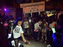 People dance in the streets after hearing of the confirmed departure of former Gambian leader Yahya Jammeh in Banjul