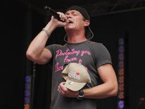 NEW YORK, NY - JULY 29: Vocalist Brad Arnold of 3 Doors Down holds a fan&#39;s &#39;I Love Jesus&#39; hat
