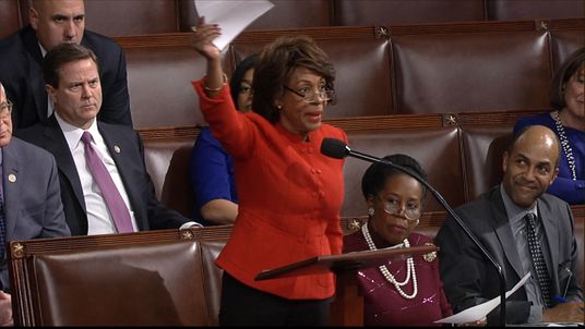 U.S. Representative for California's 43rd congressional district, Maxine Waters, asks for a Senator's signature on a written objection to Donald Trump's presidential election victory.