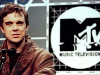 Robbie Williams speaks at a press conference October 10 announcing that he will host the 1996 MTV Europe Music Awards in London November 14