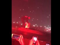 Drake helps Travis Scott clamber out of a hole at the O2