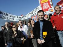 The Socialist nominee attends a workers' protest for higher wages in Paris