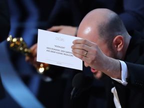 In case anyone was in doubt... the card for best picture winner is held up by Moonlight&#39;s producer