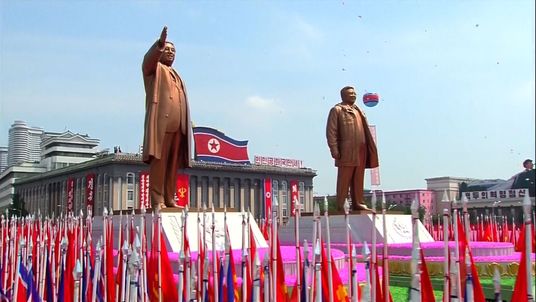 Statues of North Koreas past Supreme Leaders are paraded through Pyongyang
