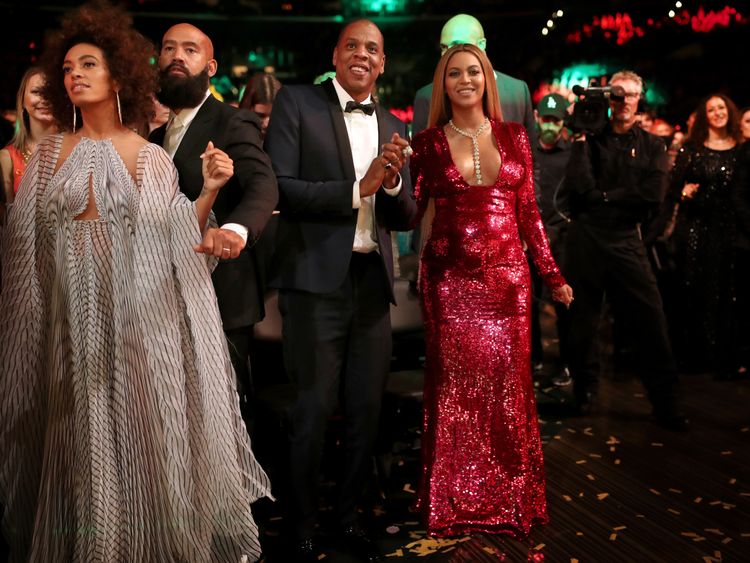 Beyonce emerged from the audience in red sequins with Jay Z and sister Solange