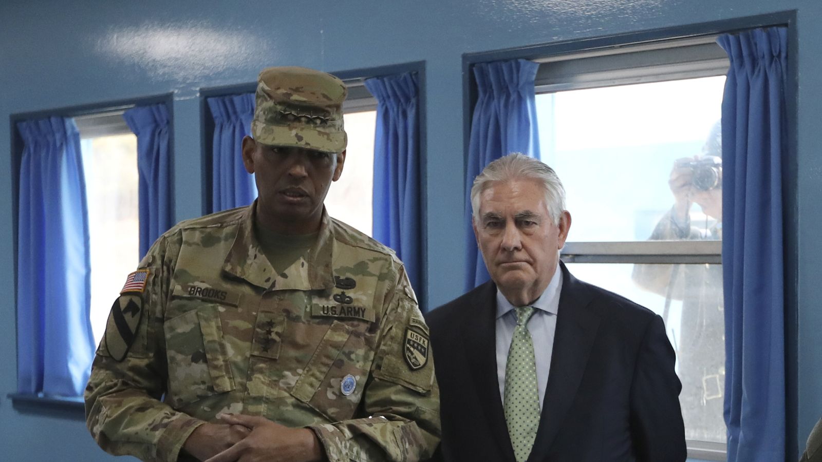Mr Tillerson snapped by a North Korean soldier at the border village of Panmunjom