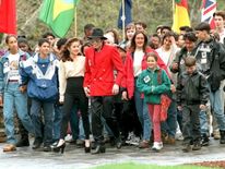 Jackson with wife Lisa Marie Presley, walking with children at his Neverland Ranch
