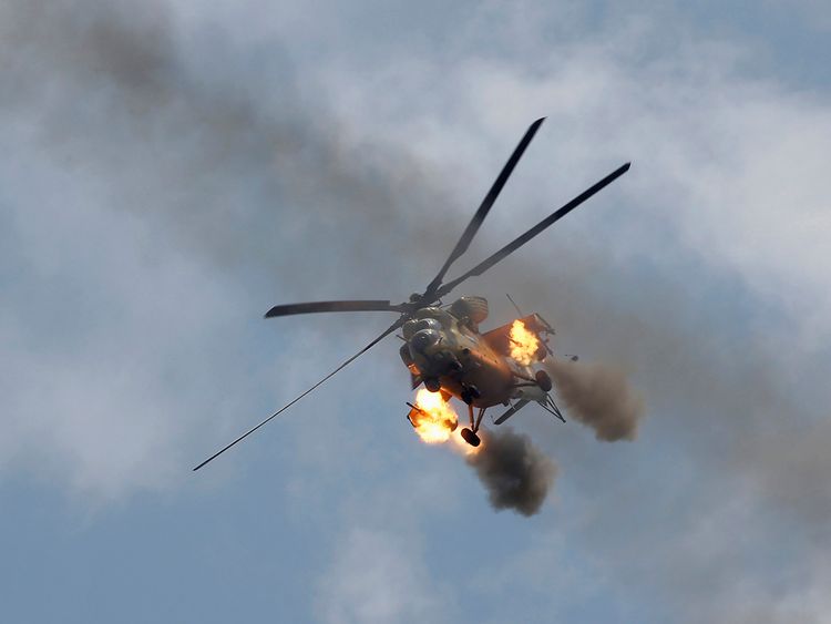An Iraqi Air Force helicopter fires missiles against Islamic State militants