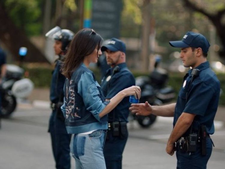 Kendall Jenner hands a police officer a Pepsi. Pic: Pepsi advert