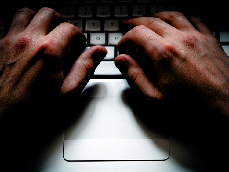 A criminal using a computer to commit crime