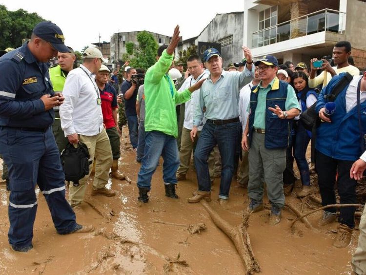 Colombia's president Juan Manuel Santos visits the area affected by a massive mudslide