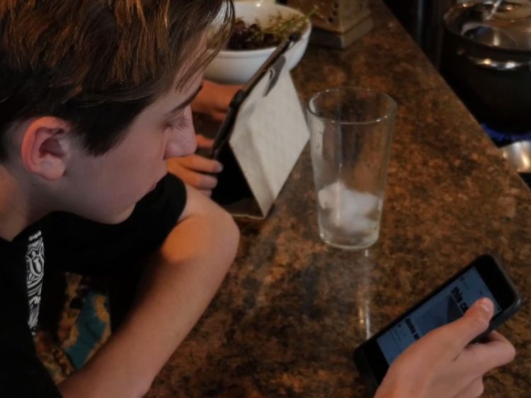 Michael Koch, 14, says he is not a technology addict - but he still has trouble putting his phone down