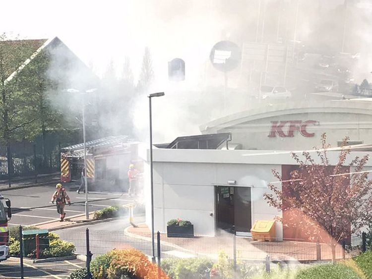 Firefighters tackle the blaze at the KFC 