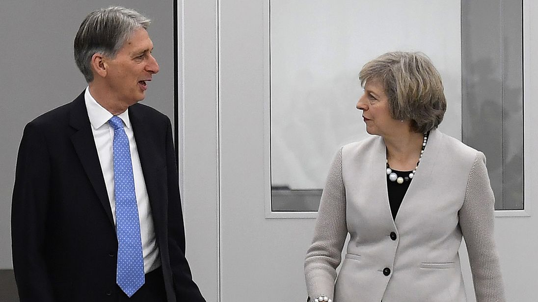 May endorses Hammond after reports of rift