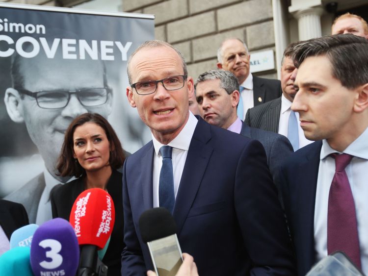 Minister for the Environment and Housing Simon Coveney (centre) alongside Minister for Health Simon Harris (right) outside Fine Gael HQ in Dublin
