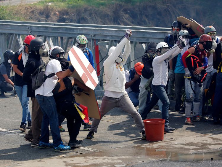 Jars containing human waste are fired at riot police