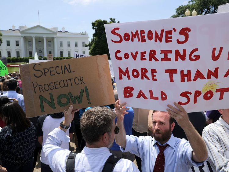 About 300 people rally to protest against President Donald Trump's firing of Federal Bureau of Investigation Director James Comey outside the White House May 10, 2017