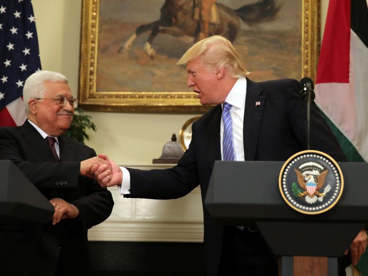 US President Donald Trump shakes hands with Palestinian President Mahmoud Abbas