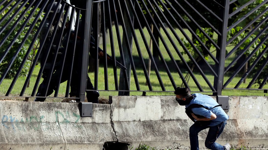 Venezuelan protesters, security forces clash at air base