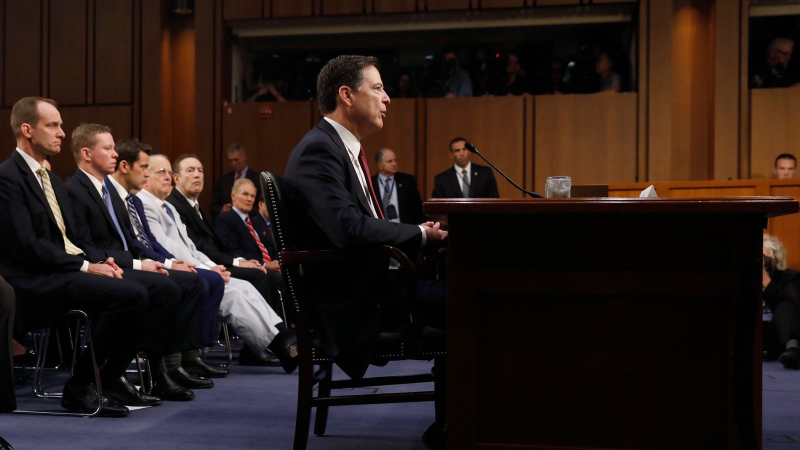 Former FBI Director James Comey testifies before a Senate Intelligence Committee