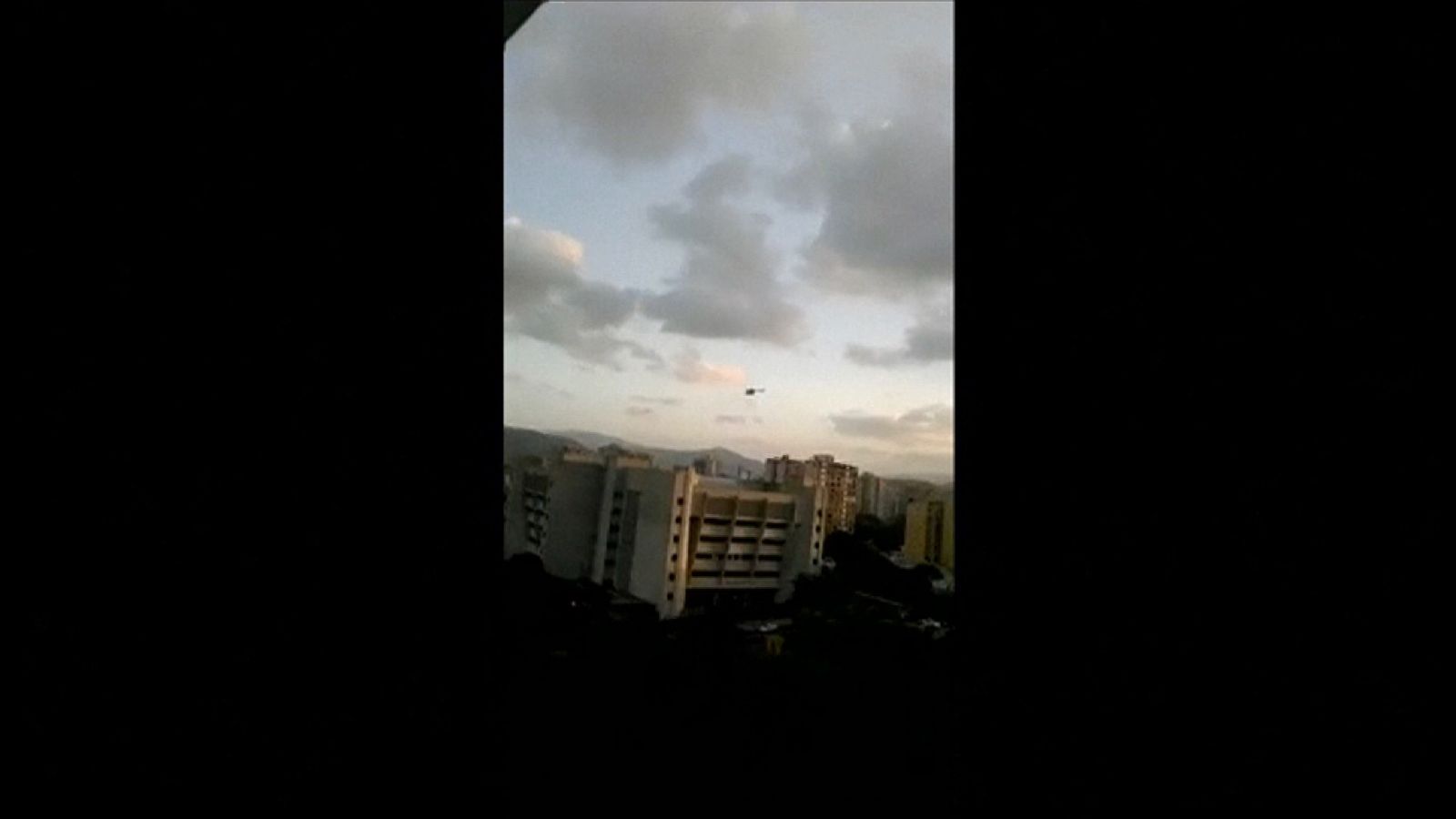 Helicopter firing shots as it flies over Venezuela's supreme court