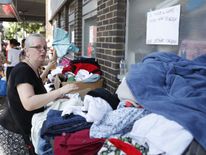 Donated clothes are laid out for those affected by the Grenfell Tower fire