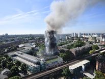 Smoke billows from a fire that has engulfed the 24-storey Grenfell Tower in west London