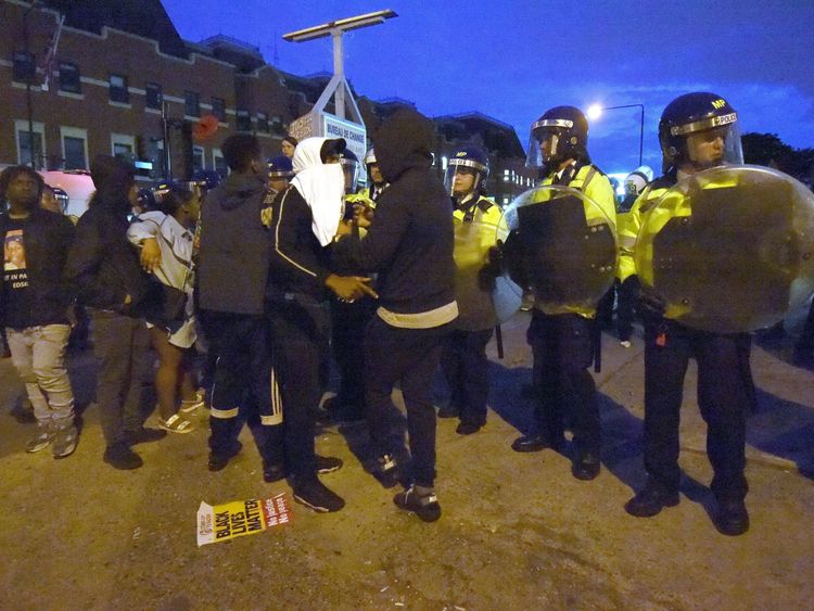Campaigners face off with police near Richmond Road in Forest Gate