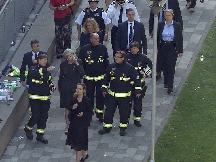 Prime Minister Theresa May visits the scene near Grenfell Tower