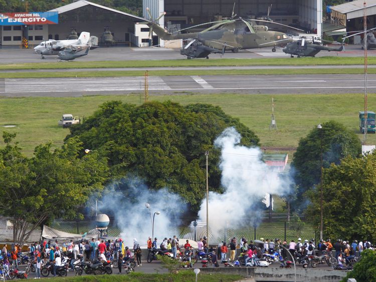 Venezuelan president's opponents lay siege to air base