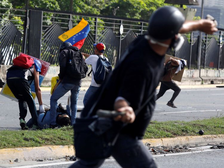 Venezuelan protesters, security forces clash at air base