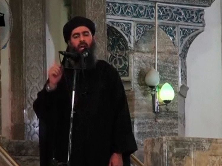 Baghdadi pictured at his first public appearance at a mosque in Mosul