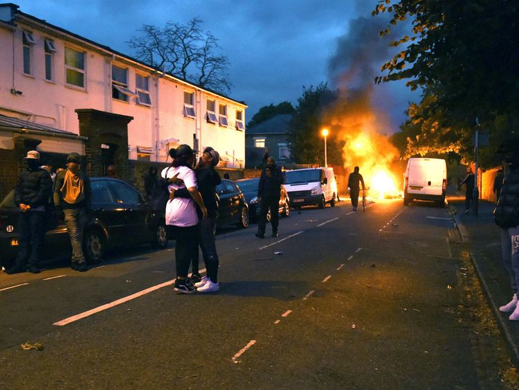 Campaigners face off with police in Richmond Road in Forest Gate