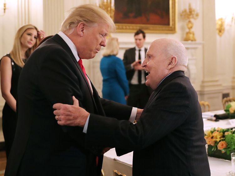 US President Donald Trump greets former General Electric CEO Jack Welch
