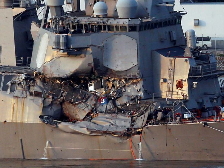 The Arleigh Burke-class guided-missile destroyer USS Fitzgerald, damaged by colliding with a Philippine-flagged merchant vessel, is towed into the U.S. naval base in Yokosuka, south of Tokyo, Japan June 17, 2017
