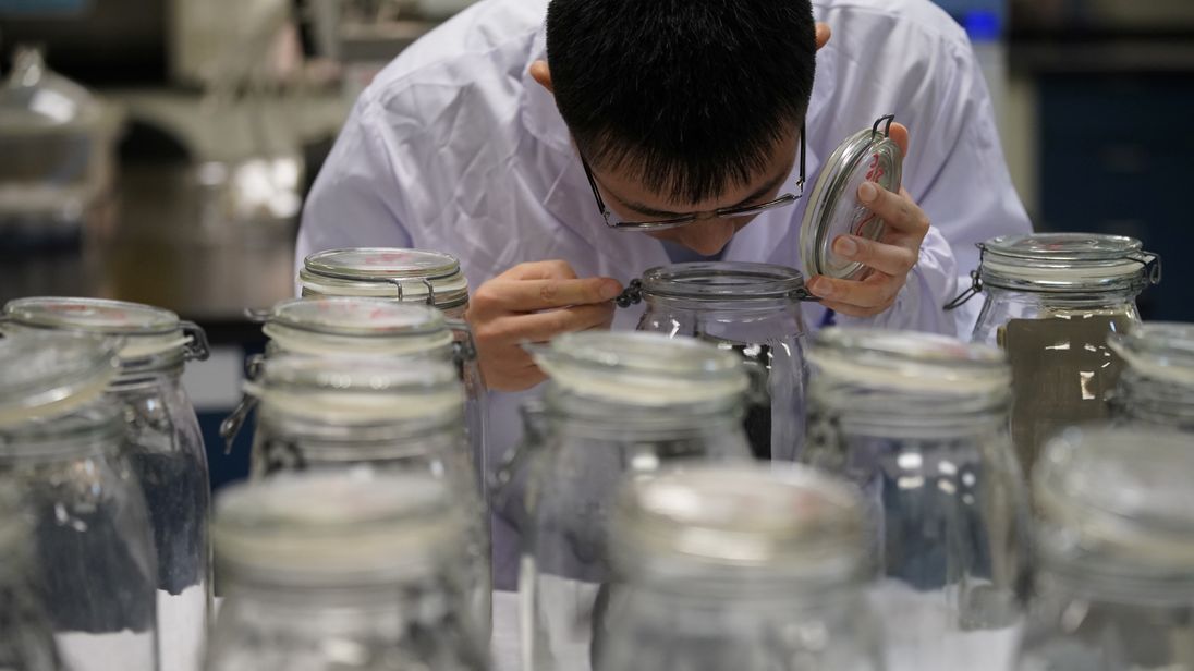 An employee conducts an odour test at the Polymer Laboratory at Ford&#39;s research and development centre in Nanjing 