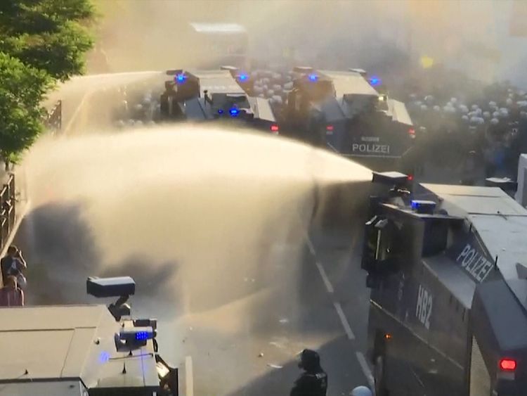 Water cannon are used by police on protesters in Hamburg ahead of G20 summit