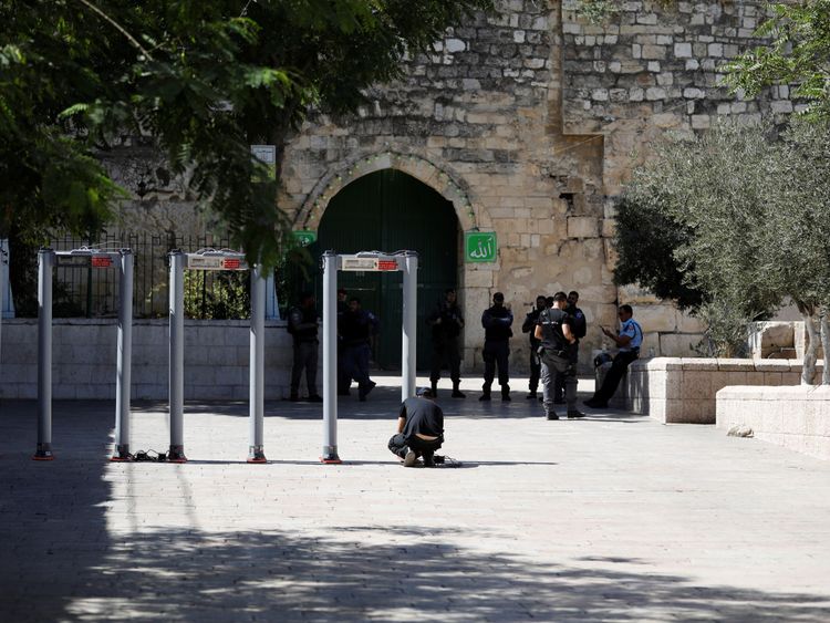 DATE IMPORTED:16 July, 2017A man installs metal detectors at an entrance to the compound known to Muslims as Noble Sanctuary and to Jews as Temple Mount, in Jerusalem's Old City July 16, 2017. REUTERS/Ronen Zvulun