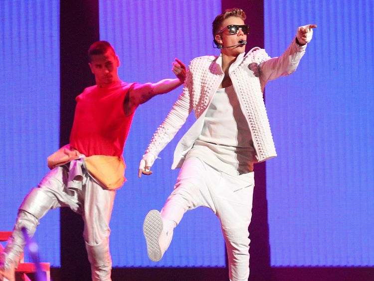 Bieber on stage in Beijing, China, during his visit in 2013