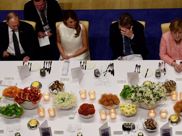 Mr Putin sat next to Melania Trump at a G20 banquet, with Angela Merkel on the right