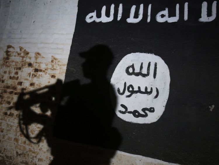Mural bearing the logo of the Islamic State