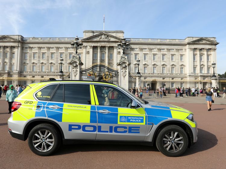A police vehicle patrols outside Buckingham Palace