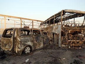 Burnt out vehicles at the scene near the southern Iraqi city of Nasiriyah