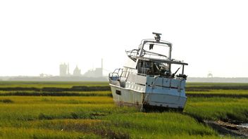 A stranded boat that was blown from the dock into a marsh after Hurricane Irma passed through in St Marys, Georgia