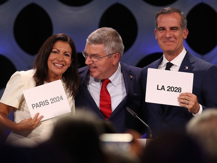 LIMA, PERU - SEPTEMBER 13: Paris Mayor Anne Hidalgo, IOC President Thomas Bach and Los Angeles Mayor Eric Garcetti react after the confirmation of the tripartite agreement which awards Paris and LA with the Olympic Games of 2024 and 2028 during the 131th IOC Session - 2024 & 2028 Olympics Hosts Announcement at Lima Convention Centre on September 13, 2017 in Lima, Peru. (Photo by Buda Mendes/Getty Images)